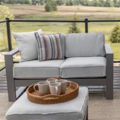 Berlin Gardens Resin Nordic Loveseat 8 Berlin Gardens Resin Nordic Loveseat -Patio Furniture Store MGP Graphite Nordic Loveseat ottomans and Sofa Cushions in Beckon Ice and throw pillows in Surround Dusk 2 edited 45905.1694716099